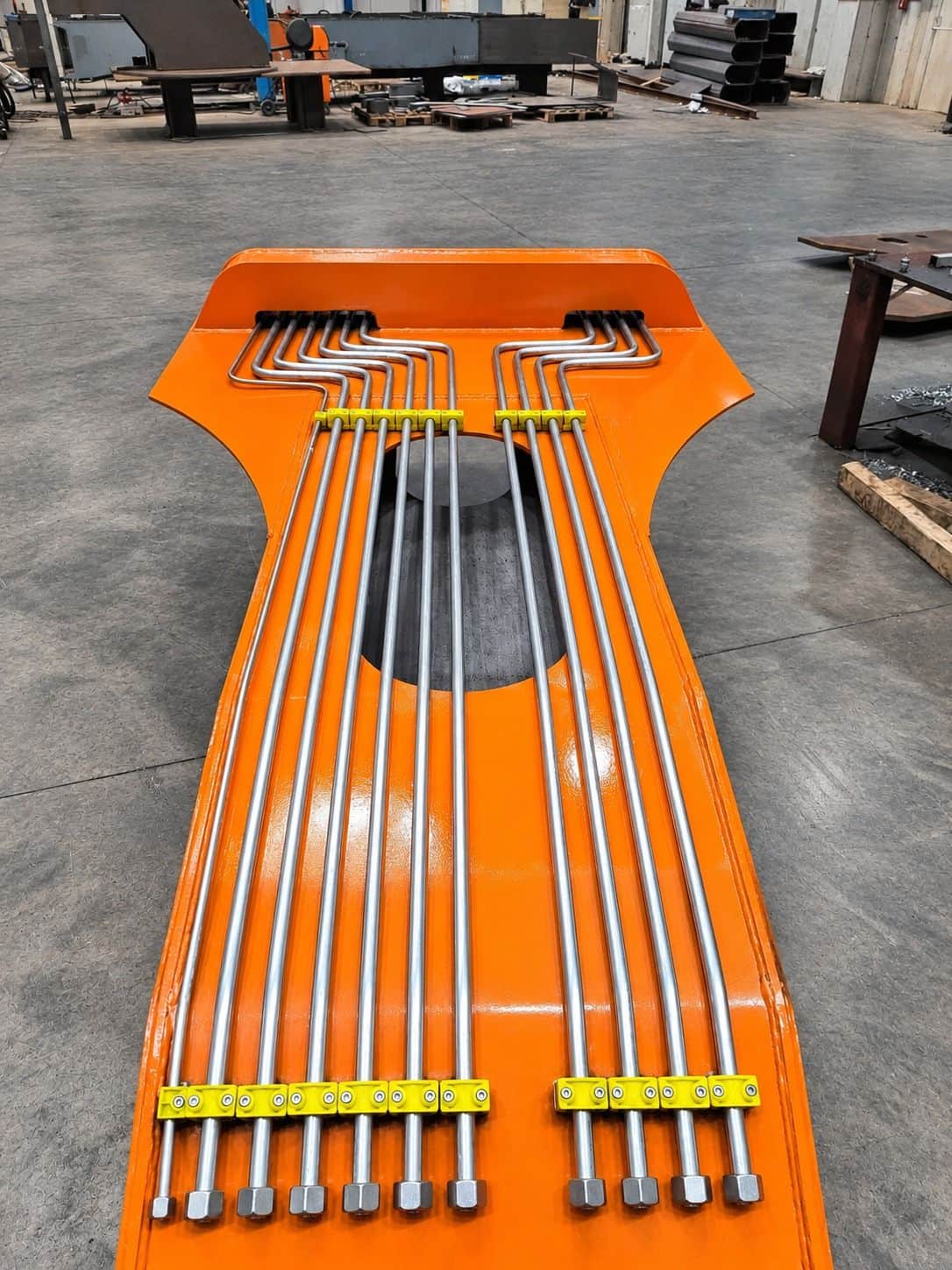 Hydraulic piping mounted on the mobile crane boom structure — high-pressure resistant clamped steel pipe assembly designed by AEB Engineering